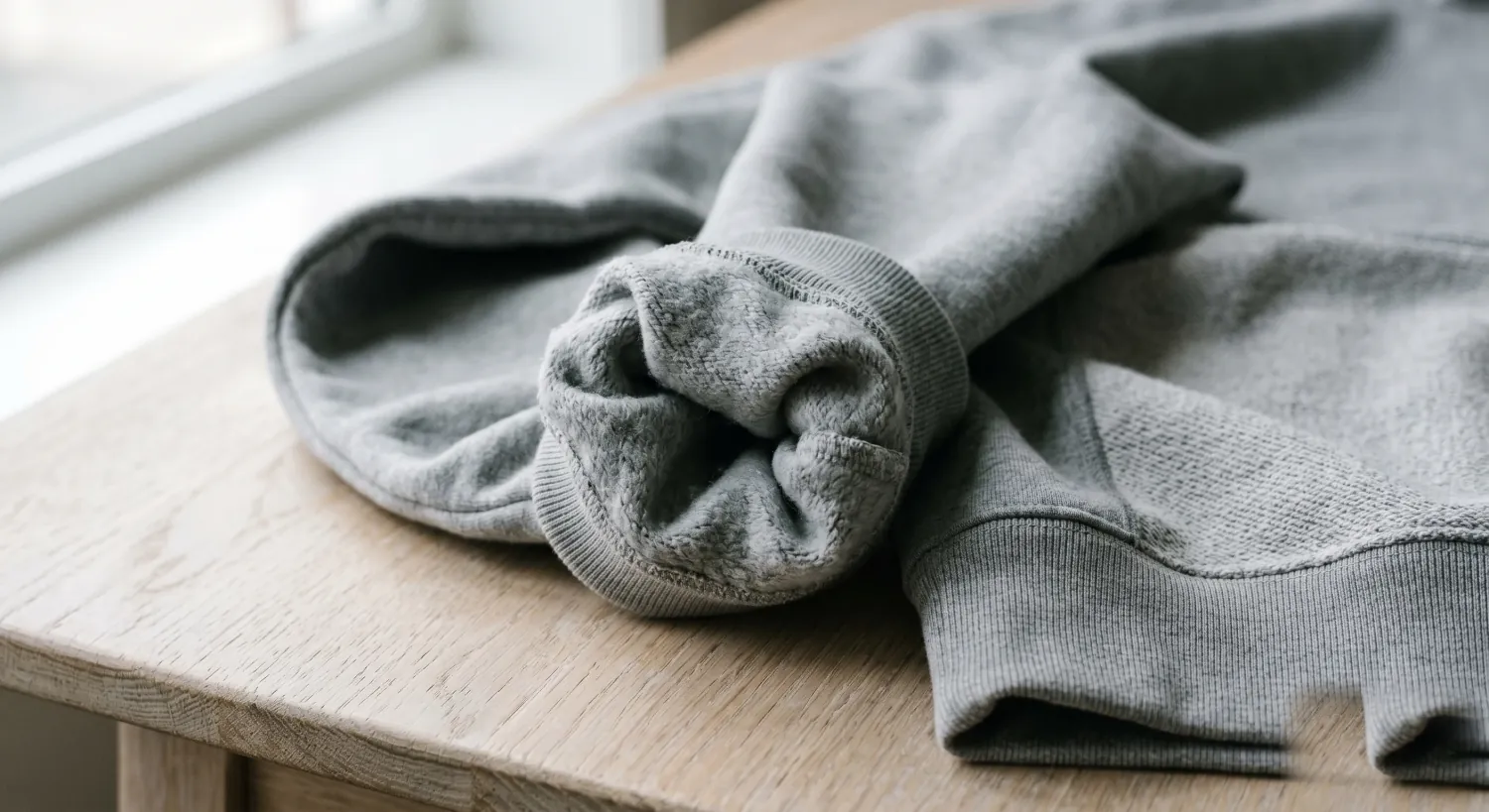 Folded 390 gsm organic cotton hoodie.